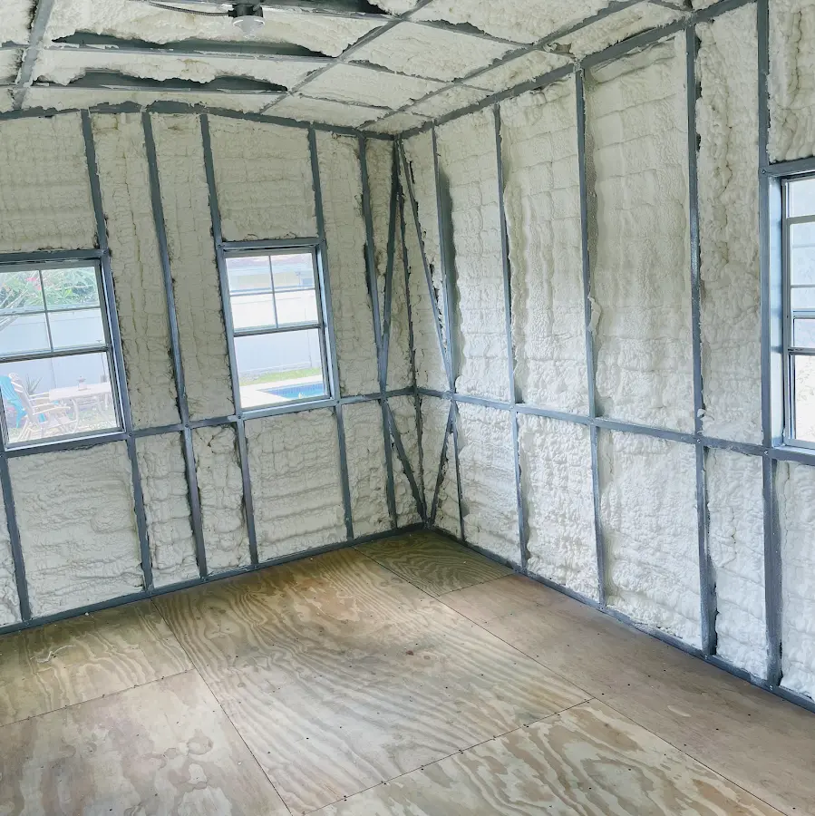 Closed-cell spray foam insulation applied to wall cavities in a residential project in Quincy